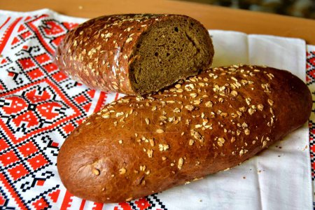 Photo for Fresh baked Rye bread on the table - Royalty Free Image