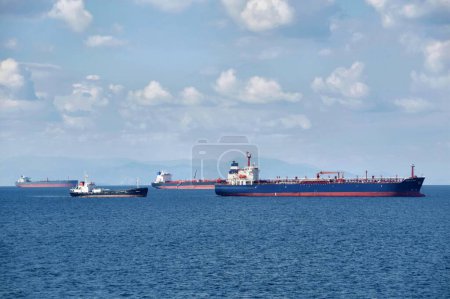Photo for Saronic gulf, Attica, Greece - October 19, 2021: Tanker ships anchored near port of Piraeus. - Royalty Free Image