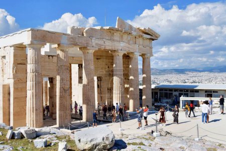 Photo for Athens, Greece, October 18, 2021: Tourists in famous gateway Propylaea at Acropolis. Propylaea is the main entrance through which thousands of tourists pass. - Royalty Free Image