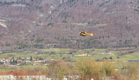 Photo for Chatillon-en-Michaille, France - 23 March, 2023:  mountain rescue service helicopter in Rhone-Alpes, France - Royalty Free Image