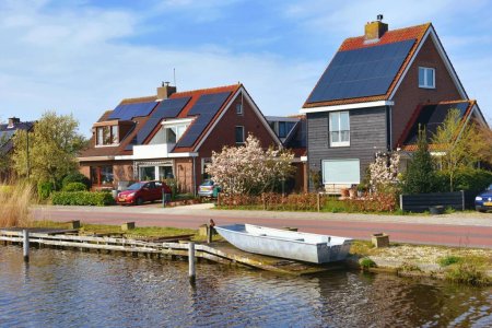 Photo for Europe, Netherlands, North Holland - April 5, 2023: View of traditional Dutch buildings along a canal in Netherlands, North Holland. - Royalty Free Image