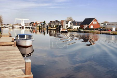 Photo for Europe, Netherlands, North Holland - April 5, 2023: View of traditional Dutch buildings along a canal and drawbridge in Netherlands, North Holland. - Royalty Free Image