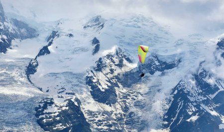 Photo for Le Brevent, France - 19th June, 2023: Paragliding near Mont Blanc on a sunny day - Royalty Free Image