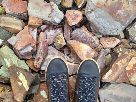Photo for Focus on Shoes on Stones - Royalty Free Image