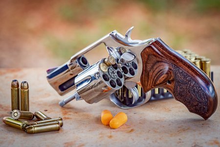 Photo for .38 caliber revolver, 2-inch barrel with finely ornamented wooden stock, close-up - Royalty Free Image