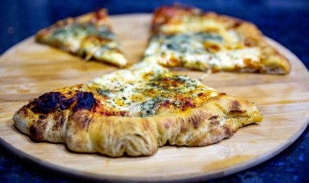Photo for Classic four cheese pizza with parmesan, gorgonzola, mozzarella and provolone - Royalty Free Image