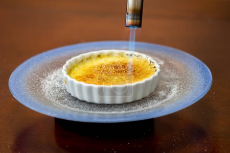 Traditional Creme brulee in selective focus and fine detail