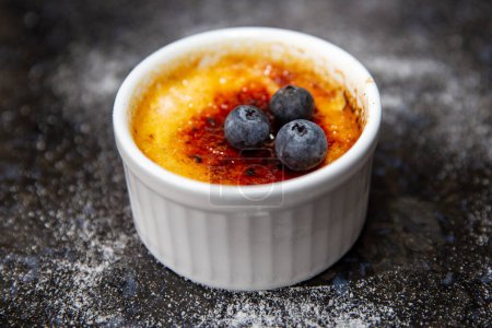 Traditional creme brule on rustic surface and selective focus