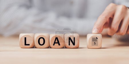 man pointing at a wooden block ,received banking loan approval ,Approval of a mortgage loan or purchase of real estate ,applying for financial credit,Financial loan agreement ,Mortgage applicatio