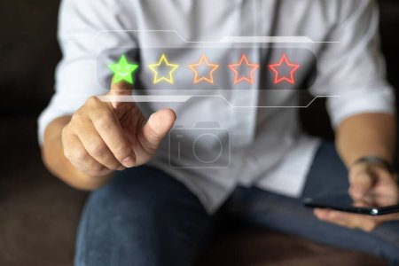 Customer service and Satisfaction concept ,Business people are touching the virtual screen on the star icon to give satisfaction in service. rating very impressed.