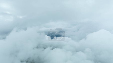 Aerial photographs were taken with a latest generation drone above dense gray clouds. Sky above the clouds and wonderful landscape photo