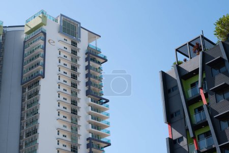 Photo for A photograph of two high-rise buildings emphasizing different exterior decoration design, and the air space between them. - Royalty Free Image