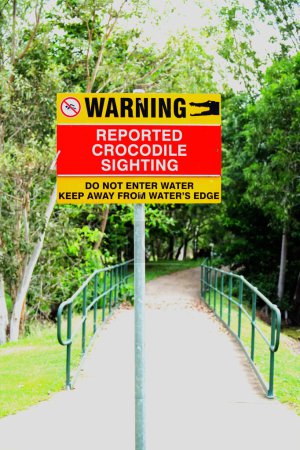 A crocodile warning sign in a northern Australia public park.