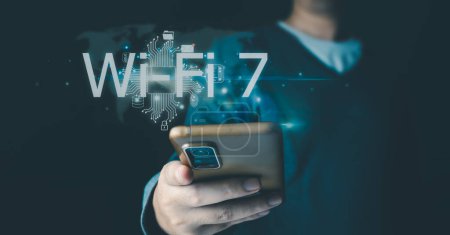 Foto de Businessman está mostrando el concepto de la tecnología futura Wi-Fi 7 y la red de conexión a Internet con AI como controlador. Un gráfico flotaba en el aire en su mano. Concepto de red del centro de datos. - Imagen libre de derechos