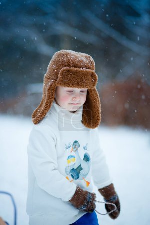 Photo for Kids playing and Having fun in the Snow - Royalty Free Image