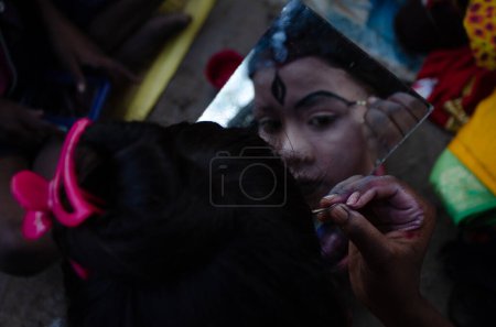Photo for There is profession in West Bengal, called "Bahurupi", to take make up of different idol of God. Then appear in public to earn money. - Royalty Free Image