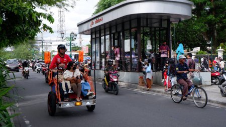 Photo for Bicycle rickshaws on Jalan Malioboro are a mode of transportation in Yogyakarta Indonesia: Yogyakarta-Indonesia, December 27, 2022. - Royalty Free Image