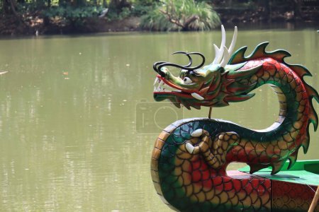 Photo for Semarang,December 2022.Dragon boat to go around the lake in the zoo to see pelicans - Royalty Free Image