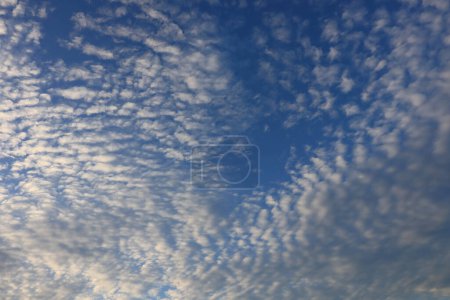 Photo for White clouds and sun against a background of blue sky - Royalty Free Image