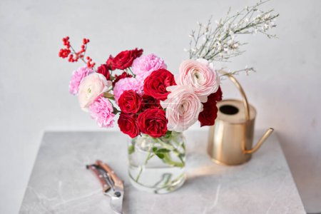 Photo for Finished flower arrangement in a vase for home. Flowers bunch, set for interior. Fresh cut flowers for decoration home. European floral shop. Delivery fresh cut flower - Royalty Free Image