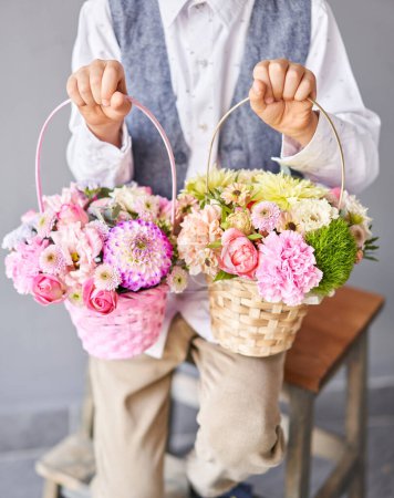 Photo for Two Small Beautiful bouquets of mixed flowers in woman hand. Floral shop concept . Beautiful fresh cut bouquet. Flowers delivery. High quality photo - Royalty Free Image