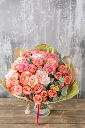 Photo for Small Beautiful bouquet of mixed flowers in vase. Floral shop concept . Beautiful fresh cut bouquet. Flowers delivery. High quality photo - Royalty Free Image