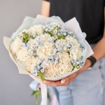 Small Beautiful bouquets of mixed flowers in woman hand. Floral shop concept . Beautiful fresh cut bouquet. Flowers delivery. High quality photo