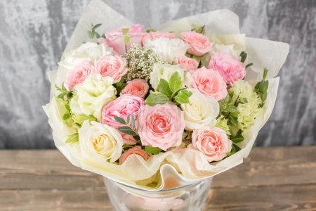 Photo for Small Beautiful bouquet of mixed flowers in vase. Floral shop concept . Beautiful fresh cut bouquet. Flowers delivery. High quality photo - Royalty Free Image