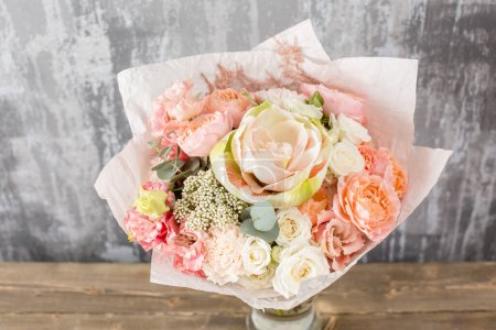 Photo for Floral shop concept. Small Beautiful bouquet of mixed flowers. Beautiful fresh cut bouquet. Flowers delivery. High quality photo - Royalty Free Image