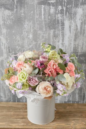 Photo for Small Beautiful bouquet of mixed flowers in woman hand. Floral shop concept . Beautiful fresh cut bouquet. Flowers delivery. High quality photo - Royalty Free Image