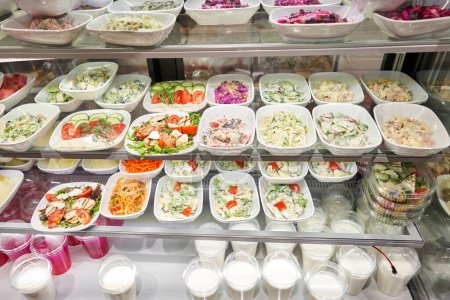 Photo for Various salads . Glass Showcase in a buffet or self-service restaurant. High quality photo - Royalty Free Image