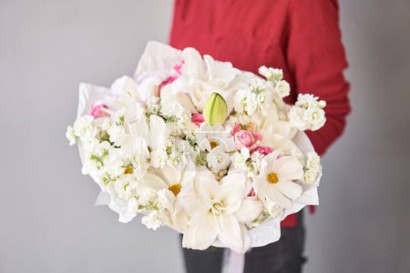 Photo for Large Beautiful bouquets of mixed flowers in woman hand. Floral shop concept . Beautiful fresh cut bouquet. Flowers delivery. High quality photo - Royalty Free Image