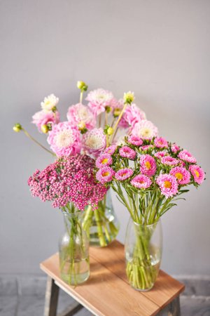 Photo for A beautiful bouquet of pink and white flowers fills a vase on a table, creating a lovely centerpiece - Royalty Free Image
