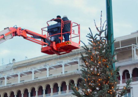 Photo for Workers preparing decorations for Christmas - Royalty Free Image