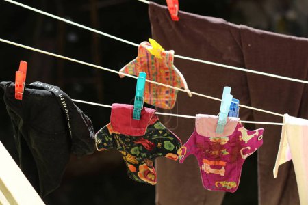 Embrace eco-friendly menstruation with these empowering images of reusable period pads hanging out to dry.