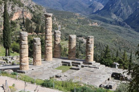 Standing tall amidst the ancient ruins of Delphi, weathered pillars bear witness to centuries of history, evoking a sense of wonder and reverence for the enduring legacy of this sacred site