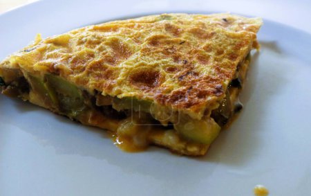 Indulge in the wholesome goodness of a nutritious courgette omelette, perfectly crafted to cater to various dietary preferences including keto