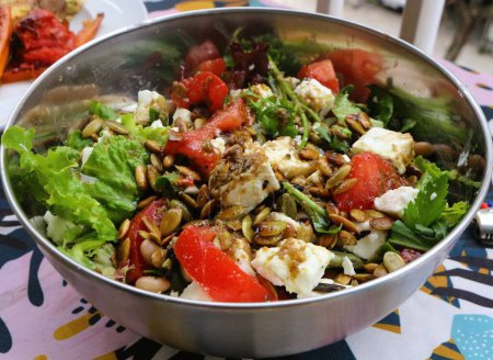 Experience the vibrant flavors and health benefits of a Greek style salad with feta