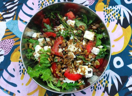 Photo for Experience the vibrant flavors and health benefits of a Greek style salad with feta - Royalty Free Image
