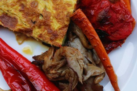 Savor the delightful combination of oven-roasted veggies paired with a fluffy omelette