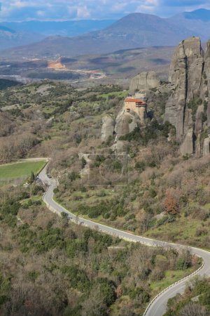 Discover serenity amidst the grandeur of Meteora's towering cliffs, where the smallest of churches offers a tranquil retreat amidst breathtaking natural beauty