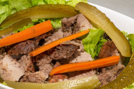 Téléchargez les photos : Pork steak with pickled carrots and cucumbers. High quality photo - en image libre de droit