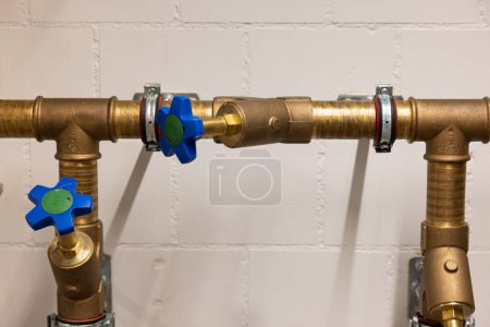 Photo for Uninsulated taps from the cold water side with copper pipes. - Royalty Free Image