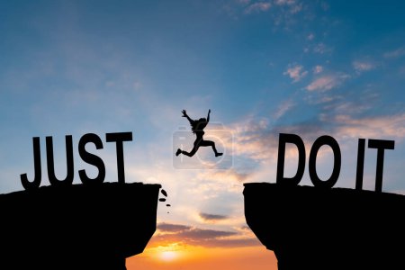 Foto de Man jumping on I can do it or I can't do it text over cliff on sunset background, Business concept idea. - Imagen libre de derechos