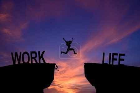 Photo for Woman jump through the gap between Work to Life on sunset. - Royalty Free Image