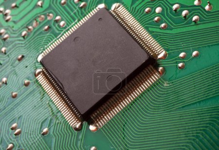 Photo for Micro Processor on an electronic circuit board. Through-hole and surface-mount  technology in one. - Royalty Free Image
