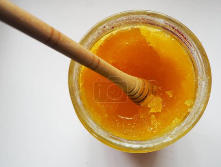 Crystallized honey in a glass jar