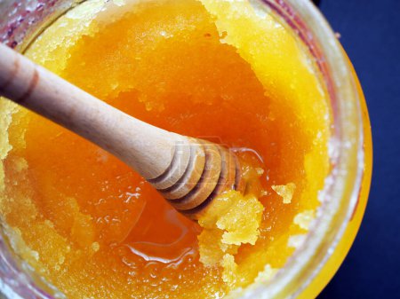 Photo for Crystallized honey in a glass jar - Royalty Free Image
