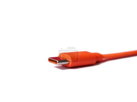 Photo for C type Usb connector isolated on the white. Usb cord in orange.  Cable for data transmisson or charge. Focused on connector. - Royalty Free Image