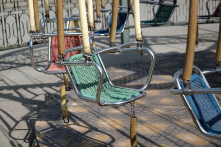 Empty and stable swing carousel chairs.